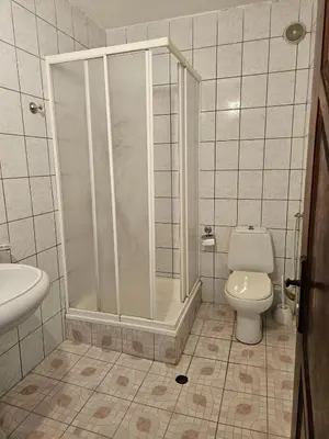 a bathroom with a shower and a toilet at Lazur Family Apartment Pomorie in Pomorie