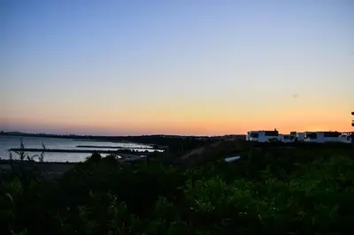 a view of the ocean at sunset at Sea Club Sarafovo Apartments in Burgas City