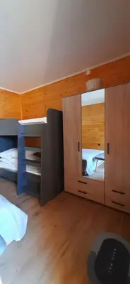 a bedroom with a mirror and a bed at Бунгало Шангри Ла - 2, плаж Градина in Sozopol
