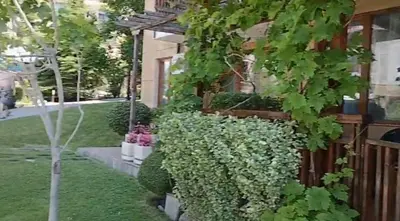 a house with green plants and a fence at Garden of Eden- Apartments Sweet Dreams Rey&Mar Saint Vlas in Sveti Vlas