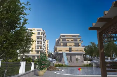 a view of two tall buildings and a pool at Grand Villa Deluxe Apart in Sveti Vlas
