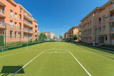 a tennis court in the middle of a city at Double Cream Apartment in Tŭnkovo