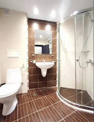 a bathroom with a toilet and a sink and a shower at The Red Studio in Burgas City