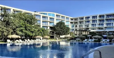 a large apartment building with a large swimming pool at The Red Studio in Burgas City