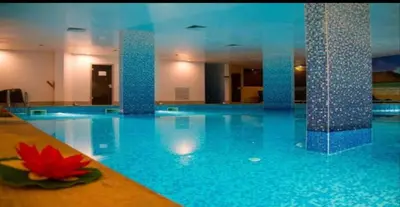 a large swimming pool with a red flower in the middle at The Red Studio in Burgas City