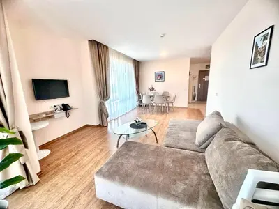 a living room with a couch and a table at Premier Fort Beach Sveti Vlas in Sveti Vlas