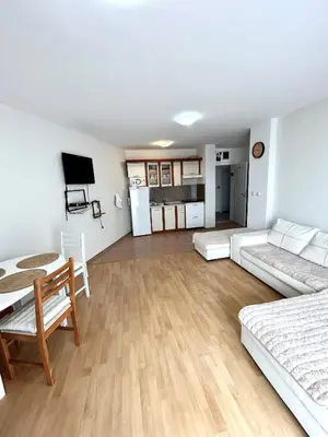 a living room with a couch and a table at Fort Noks PRIVILEGE Apartment in Sveti Vlas