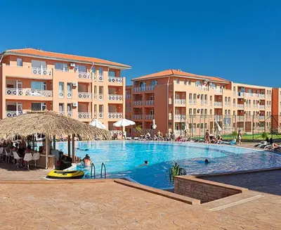 a large swimming pool with people in a resort at Съни Дей ,Слънчев бряг in Burgas City