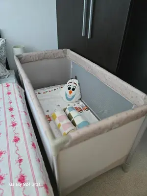 a crib with a snowman toy in it at Apartament Primavera Atlantis SPA in Burgas City