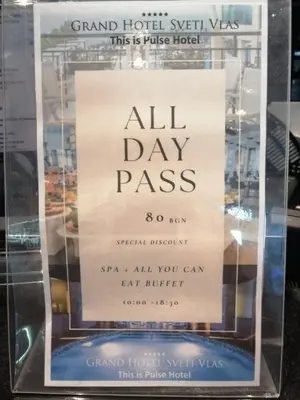 a sign in a glass case with a sign that reads all day pass at Lovely Studio with Sea View Grand Hotel Sveti Vlas in Sveti Vlas