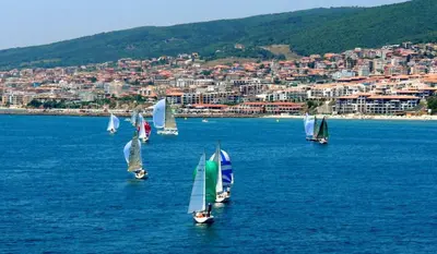 a group of sailboats in a large body of water at Sea Sirena with a Mountain View in Sveti Vlas