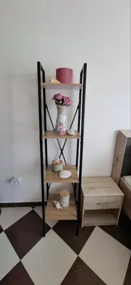 a shelf with a vase on it in a room at Cozy Studio in Hacienda by Flat Mаnager in Sozopol