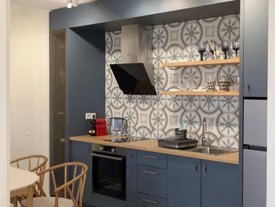 a kitchen with a sink and a stove top oven at Solea Suites in Chernomorets