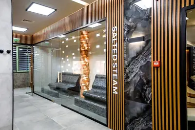 a lobby with stairs and a wall of glass at Solea Studio in Chernomorets