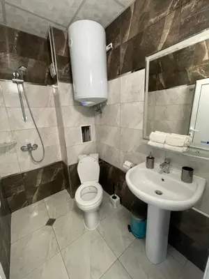 a bathroom with a toilet and a sink at Апартамент Студио Endless Созопол in Sozopol
