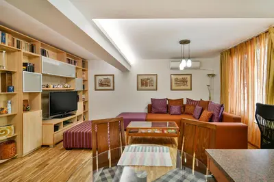 a living room with a couch and a tv at Budget Flat in Central Varna in Varna City