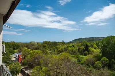 a view of the countryside from a balcony of a house at Luxury apartment with sea view,FREE parking! in Varna City