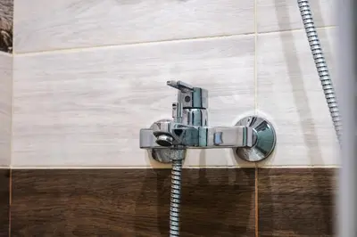 a shower in a bathroom with a hose at Luxury apartment with sea view,FREE parking! in Varna City