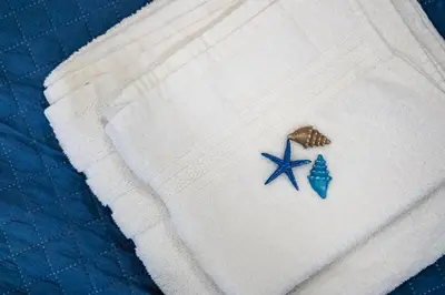 a white sweater with two blue stars on it at Cozy Studio in Varna City Center in Varna City