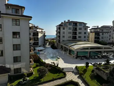 an aerial view of a building with a courtyard at Perfect Sea and Pool View Long Beach Apartment in Shkorpilovtsi