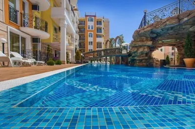 a swimming pool in the middle of a building at Nemo's apartment - Sunny Beach in Sunny Beach