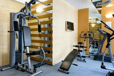 a gym with treadmills and elliptical machines at Nemo's apartment - Sunny Beach in Sunny Beach