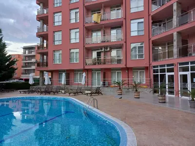 a swimming pool in front of a building at Rainbow 2 studio 40 in Sunny Beach