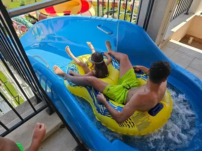 a group of people laying on a raft in a pool at Rainbow 2 studio 40 in Sunny Beach