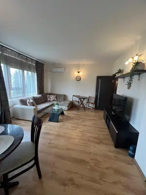 a living room with a couch and a table at Apartment Chocolate Ravda in Ravda