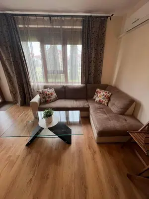 a living room with a couch and a glass table at Apartment Chocolate Ravda in Ravda