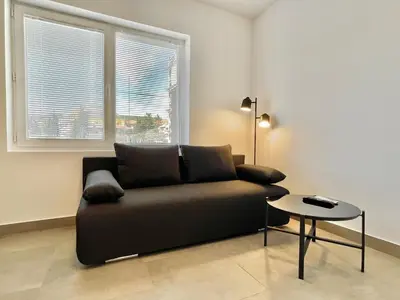 a living room with a couch and a table at Carina Beach - Private apartment - BSR - 1 in Sunny Beach