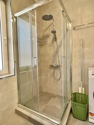 a shower with a glass door in a bathroom at Carina Beach - Private apartment - BSR - 1 in Sunny Beach