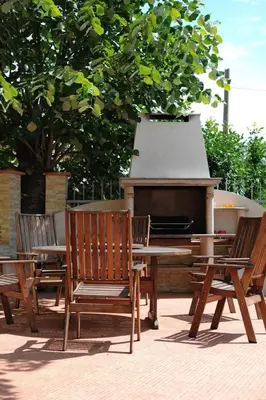 a group of chairs and a table and a piano at Splendid sunny seasons in Byala