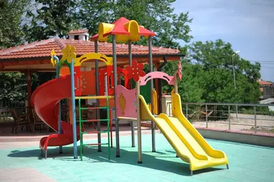 a playground with a slide and a slideintend at Splendid sunny seasons in Byala