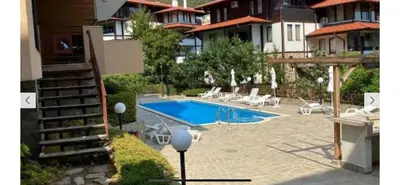 a swimming pool in the middle of a house at Apartment in complex Sirena! in Sveti Vlas