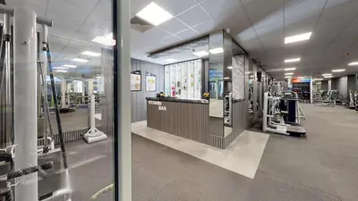 a large room with a gym with machines at Flores Garden Pool & Sea View Studio in Chernomorets
