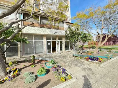 a garden with flowers in front of a building at Pomorian Pearl in Pomorie