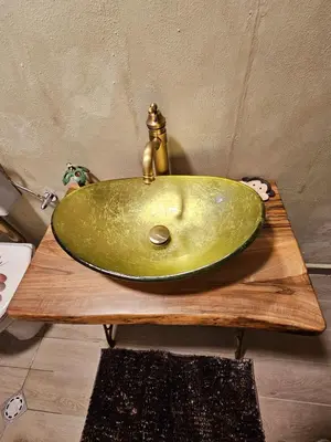 a green bathroom sink sitting on a wooden table at Бунгало HAKUNA MATATA, Къмпинг Созопол Еко, плаж Градина in Sozopol