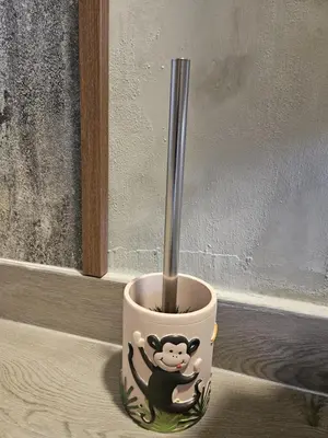 a cup with a monkey on it with a spoon in it at Бунгало HAKUNA MATATA, Къмпинг Созопол Еко, плаж Градина in Sozopol