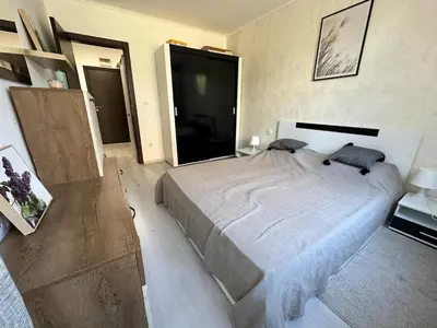 a bedroom with a large bed in a room at Apartment in Sveti Vlas in Sveti Vlas