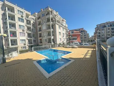 a swimming pool in the middle of a building at Apartment in Sveti Vlas in Sveti Vlas