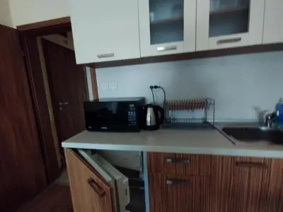 a kitchen counter with a microwave and a sink at Studio Zora in Burgas City