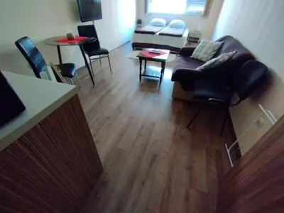 a living room with a couch and a table at Studio Zora in Burgas City