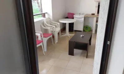 a view of a living room with a table and chairs at Etara 2 Apartment in Sveti Vlas