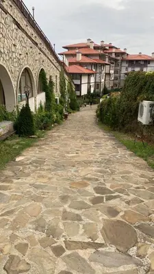 a cobblestone street next to a building and buildings at Etara 2 Apartment in Sveti Vlas