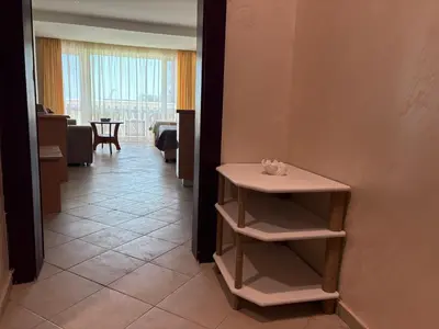 a hallway with a small table in a room at Miramar palace 615S in Sunny Beach