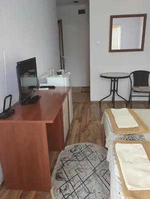 an office with a desk with a computer and a table at Къща за гости Ками in Byala