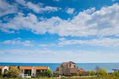 a house with the ocean in the background at 