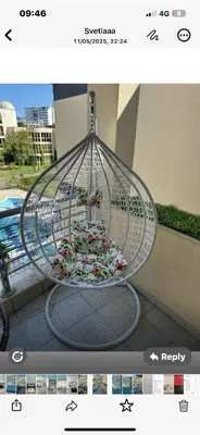 a metal bird cage with flowers in it at Дрийм 2 Мечта 2 in Sunny Beach