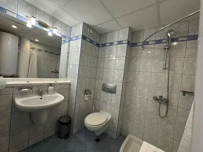 a bathroom with a toilet and a shower and a sink at Nana Studio Sunny Beach in Sunny Beach